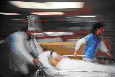 Doctors rushing Personal Injury Victim into Hospital