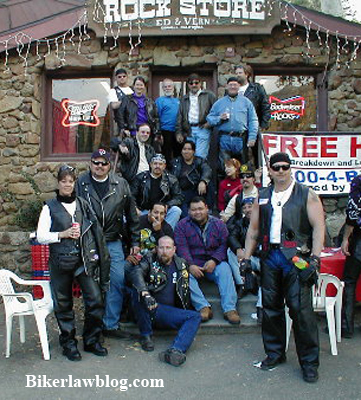 Norman Gregory Fernandez with a group of motorcyclist at the Rock Store in California